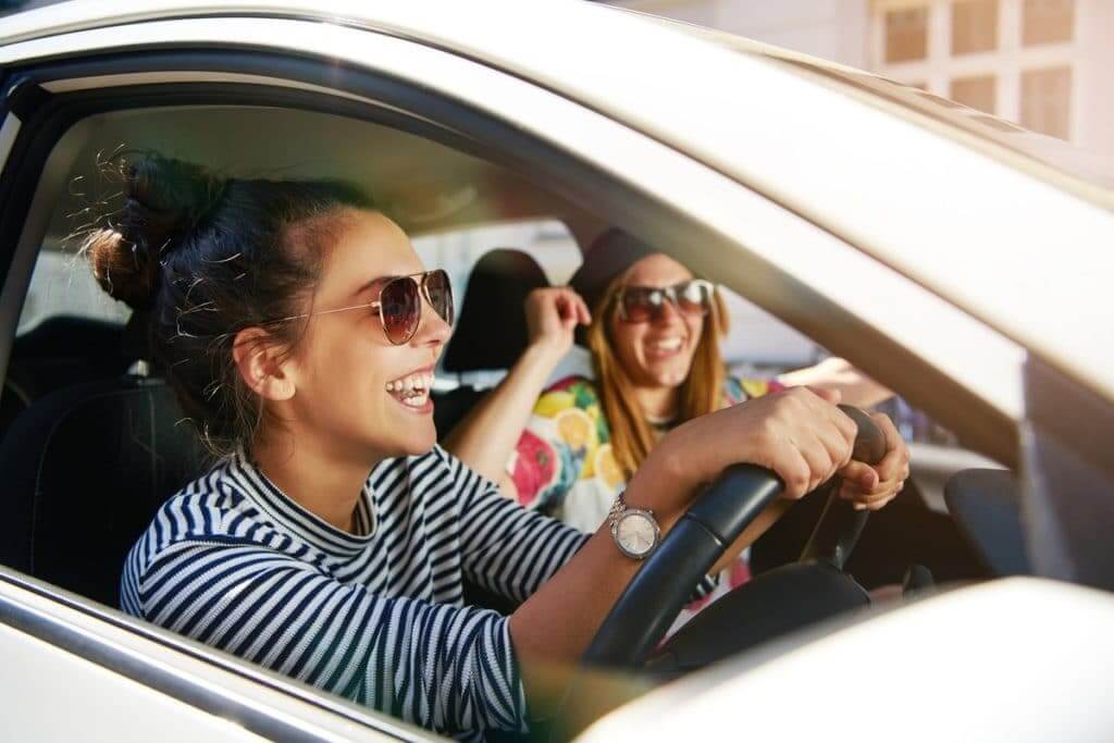 Two young women driving