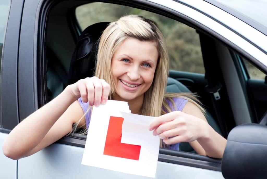 Blonde woman tearing up L plate