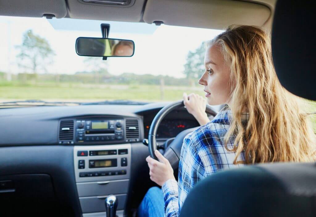 Blonde woman driving