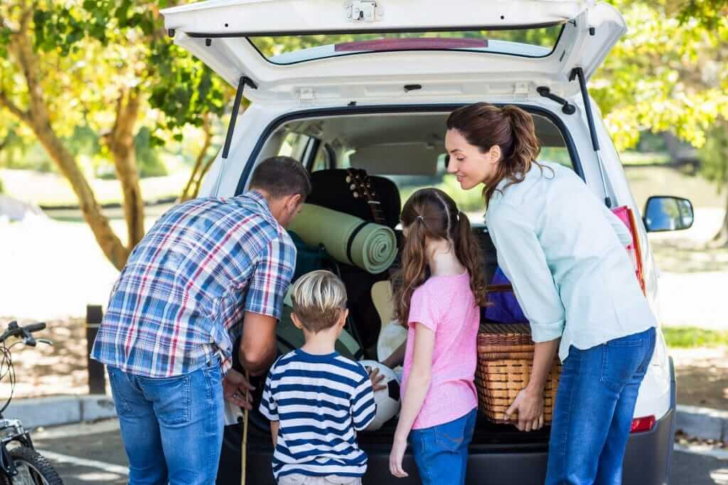 Family packing a car