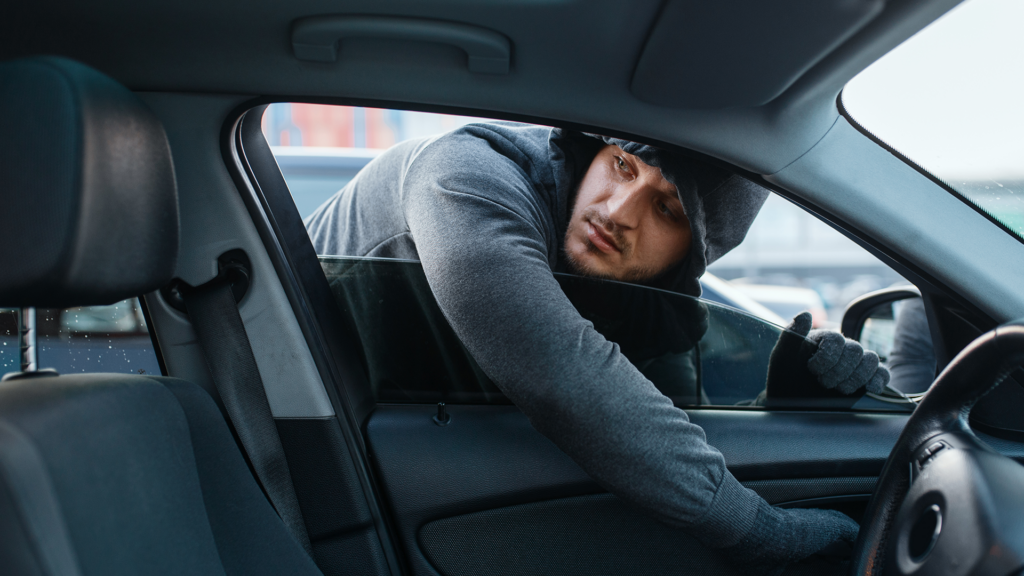 A man stealing a car